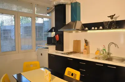 a kitchen with a sink and a counter top at Arlequin Apartment in Varna City