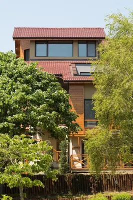 a house with a red roof and some trees at Holiday Village Lozenets in Lozenets
