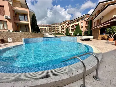 a large swimming pool in the middle of a building at Panorama Dreams - Menada Apartments in Sveti Vlas