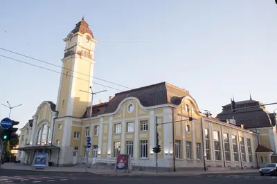 a large building with a clock tower on a street at The Square - Old Flat with 2 bedrooms, 1st fl in Burgas City