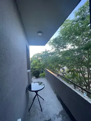 a room with a table on a balcony at City Center Apartment 2 in Varna City