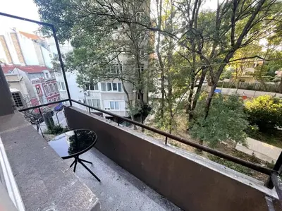 a balcony with a bench and a view of a street at City Center Apartment 1 in Varna City