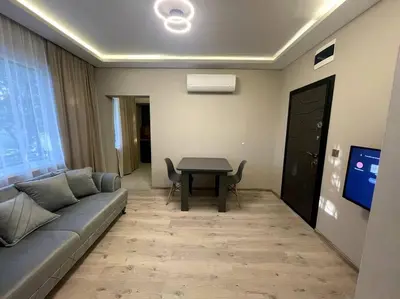 a living room with a couch and a table at City Center Apartment 1 in Varna City