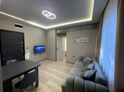 a living room with a couch and a table at City Center Apartment 1 in Varna City