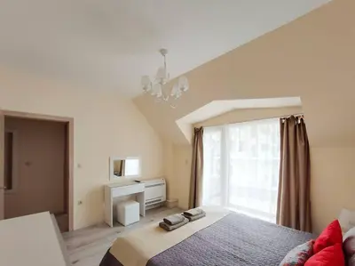 a bedroom with a bed and a large window at Beachfront Panoramic Flat @ South Bay residence in Varna City