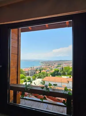 a large window with a view of a city at Квартира с потрясающим видом in Sveti Vlas