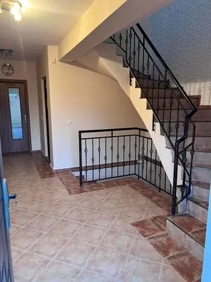 a staircase in a home with a tile floor at Къща Каменар in Pomorie