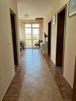 a hallway with a tile floor in a house at Къща Каменар in Pomorie