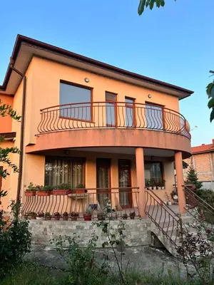 a house with a balcony on top of it at Къща Каменар in Pomorie