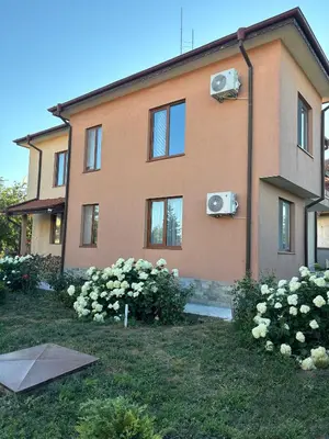 a house with white flowers in front of it at Къща Каменар in Pomorie