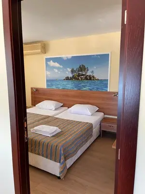 a bedroom with two beds and a view of the ocean at Hotel Star in Sunny Beach