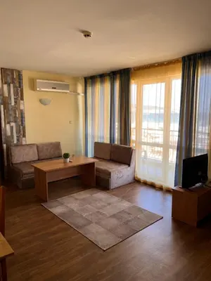 a living room with a couch and a table at Hotel Star in Sunny Beach
