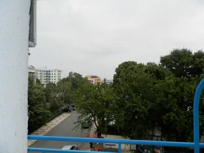 a view from a balcony of a street with trees at Hotel North in Primorsko