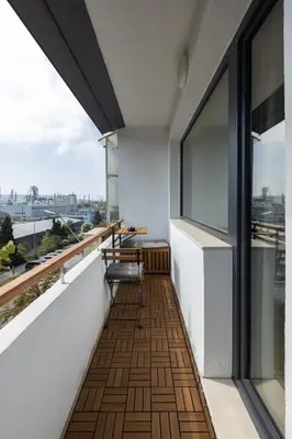a balcony with a view of the city at TOPAZ Beachfront Apartment in Varna City