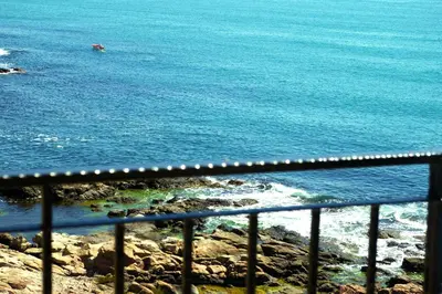 a view of the ocean from a balcony at Sea View Apartments in Sozopol