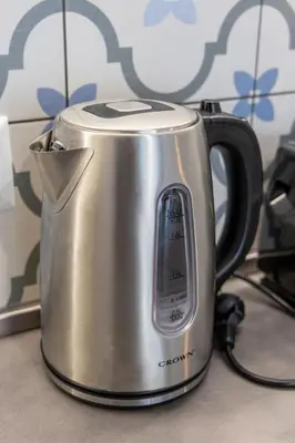 a silver tea kettle sitting on a counter at Roman Thermae Central Studio in Varna City