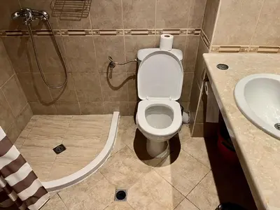 a bathroom with a toilet and a sink at Alexandr apartments Vigo Nesebar in Nesebar