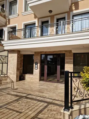 a building with a balcony on top of it at Polarstar 2-Zimmer Appartements in Sveti Vlas