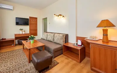 a living room with a couch and a table at Hotel Venus in Sunny Beach