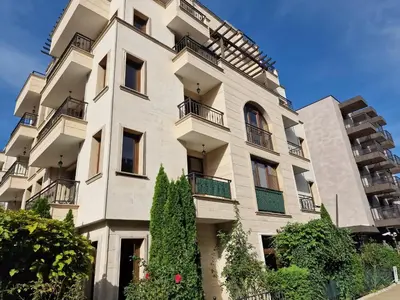 an apartment building in front of a blue sky at Słoneczny Brzeg Studio Amara in Sunny Beach