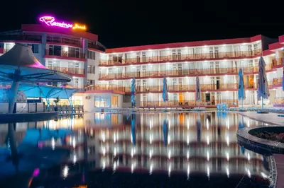 a hotel with a pool in front of a building at Flamingo Beach Hotel in Sunny Beach
