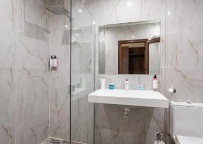 a bathroom with a sink and a shower at Flamingo Beach Hotel in Sunny Beach