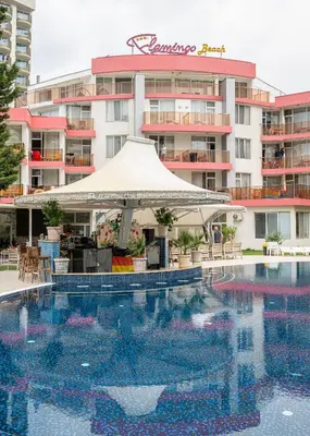 a hotel swimming pool with a tent in front of a building at Flamingo Beach Hotel in Sunny Beach