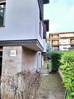 a building with a sign on the side of it at Marina Sun Sea View Apartment in Sozopol