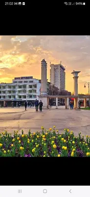 a group of people walking in a city with buildings at Festival and Congress Centre Appartment Varna in Varna City