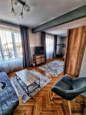 a living room with a couch and a table at Sea Light in Burgas City