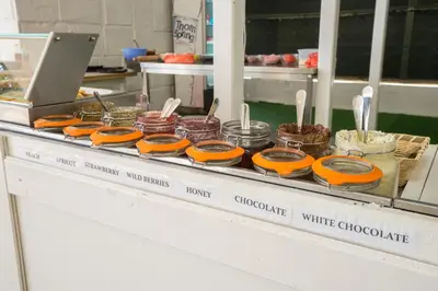 a buffet line with donuts and other food items at Perla Royal Hotel - All Inclusive in Primorsko