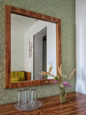 a mirror on a wall with glasses on a table at Elizabeth Dy Boutique Hotel in Nesebar