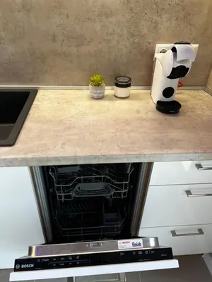 a counter top with an oven in a kitchen at Varna downtown apartment in Varna City