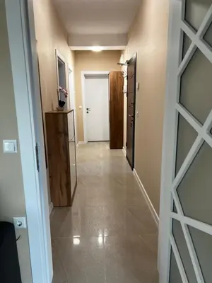 a hallway with a door leading into a room at Varna downtown apartment in Varna City