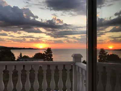 a view of a sunset from the balcony of a house at Villa Livia Boutique Apartments in Ravda
