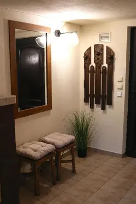 a waiting room with two stools and a mirror at Cozy Nest Charming Loft in the heart of Varna in Varna City