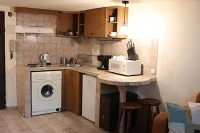 a kitchen with a sink and a washing machine at Cozy Nest Charming Loft in the heart of Varna in Varna City
