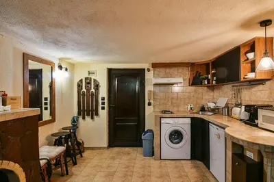 a kitchen with a washing machine in a kitchen at Cozy Nest Charming Loft in the heart of Varna in Varna City