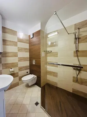 a bathroom with a toilet and a sink and a shower at Apolonia Apartments - Boutique Family Residence in Sozopol