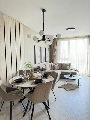 a living room with a table and chairs and a couch at Kristin`s Home in Burgas City