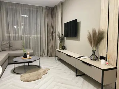 a living room with a couch and a table at Kristin`s Home in Burgas City