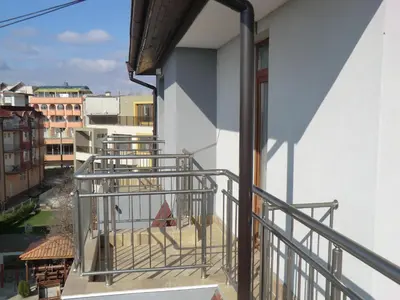 a balcony with a view of a city at Guest House Petrovi in Ravda