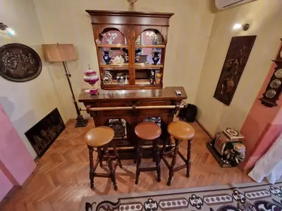 a room with a wooden desk and stools at ap Malinov 15 in Varna City