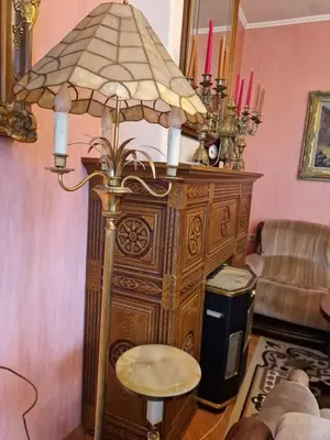a lamp with a table in a living room at ap Malinov 15 in Varna City