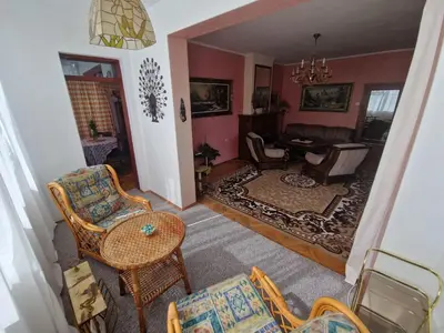 a living room with chairs and a table at ap Malinov 15 in Varna City