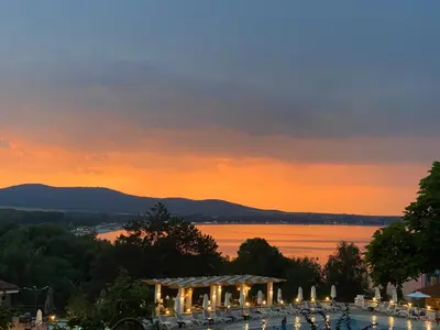 a view of a pool with lights at sunset at AJ Apartment 2, Santa Marina Holiday Village, Sozopol in Sozopol