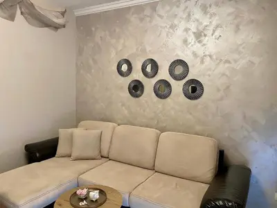 a living room with a white couch and a table at AJ Apartment 2, Santa Marina Holiday Village, Sozopol in Sozopol