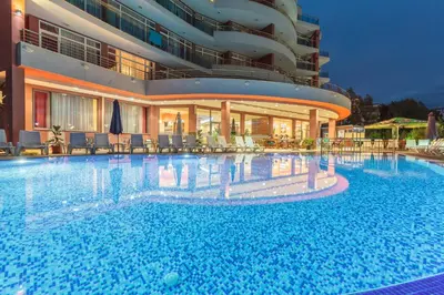 a large swimming pool in front of a building at Hotel RIAGOR - ALL INCLUSIVE in Sunny Beach