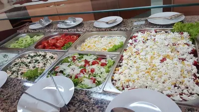 a buffet of different types of food on a table at Hotel RIAGOR - ALL INCLUSIVE in Sunny Beach