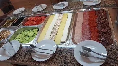 a buffet of different types of food on a table at Hotel RIAGOR - ALL INCLUSIVE in Sunny Beach